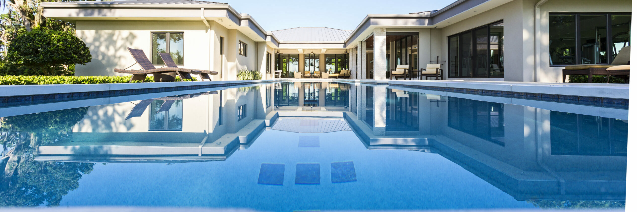 Elegance A beautiful pool deck setting on a calm summer morning.