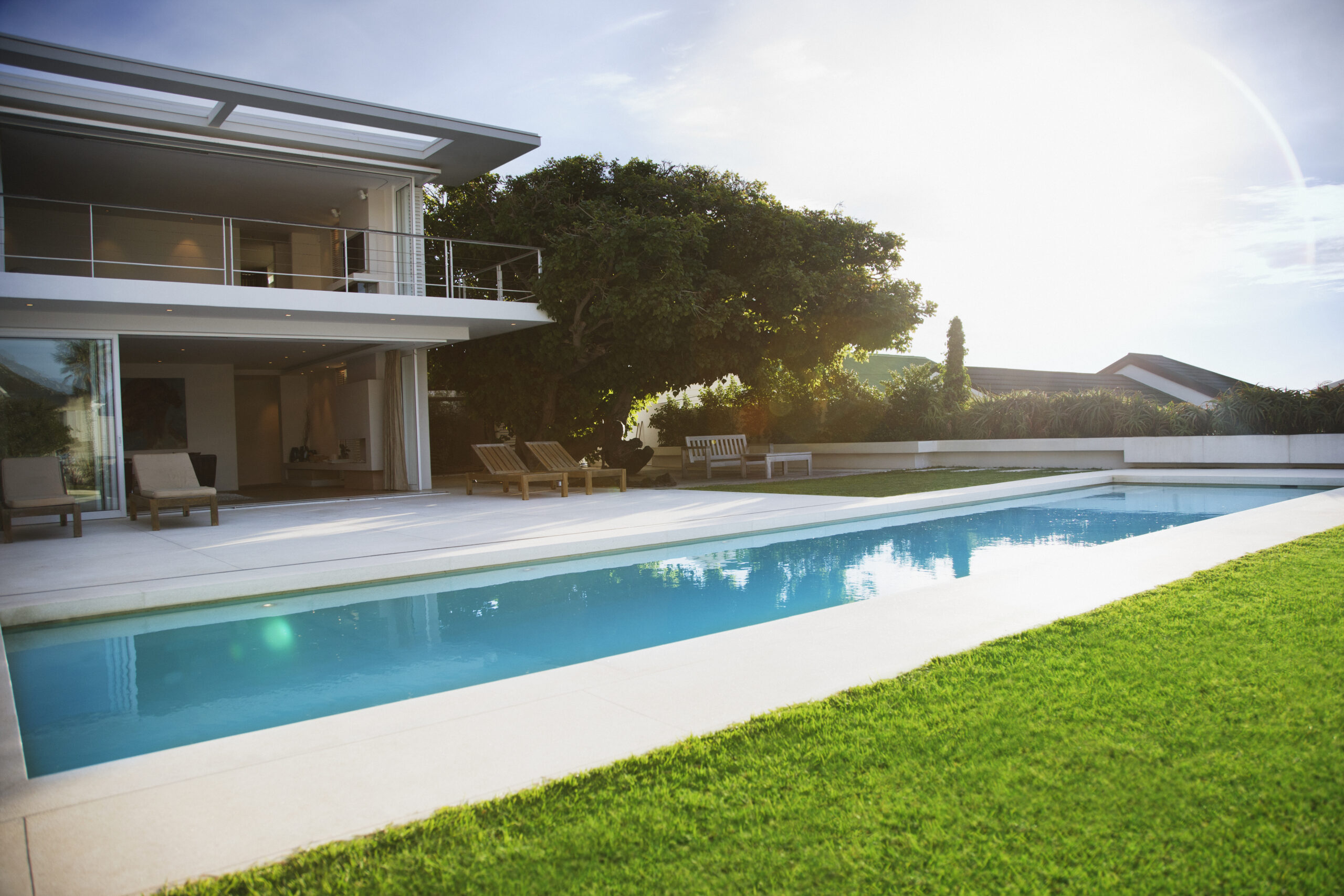 Modern house and swimming pool Photo for the Create A Garden Oasis For Your Backyard Pool Swimart DIY Tips article.