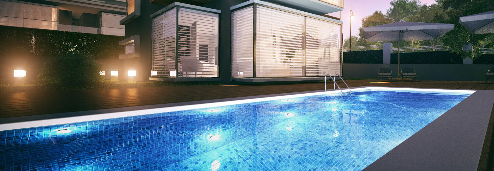 Night view of a modern villa with a swimming pool in front of it.