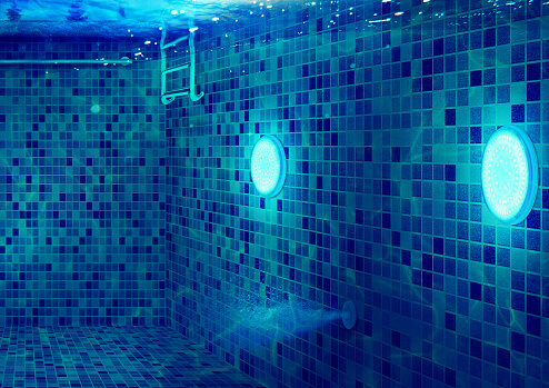 pool LED lighting underwater on tiled pool walls